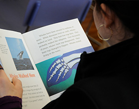Photo of a student reading a book.